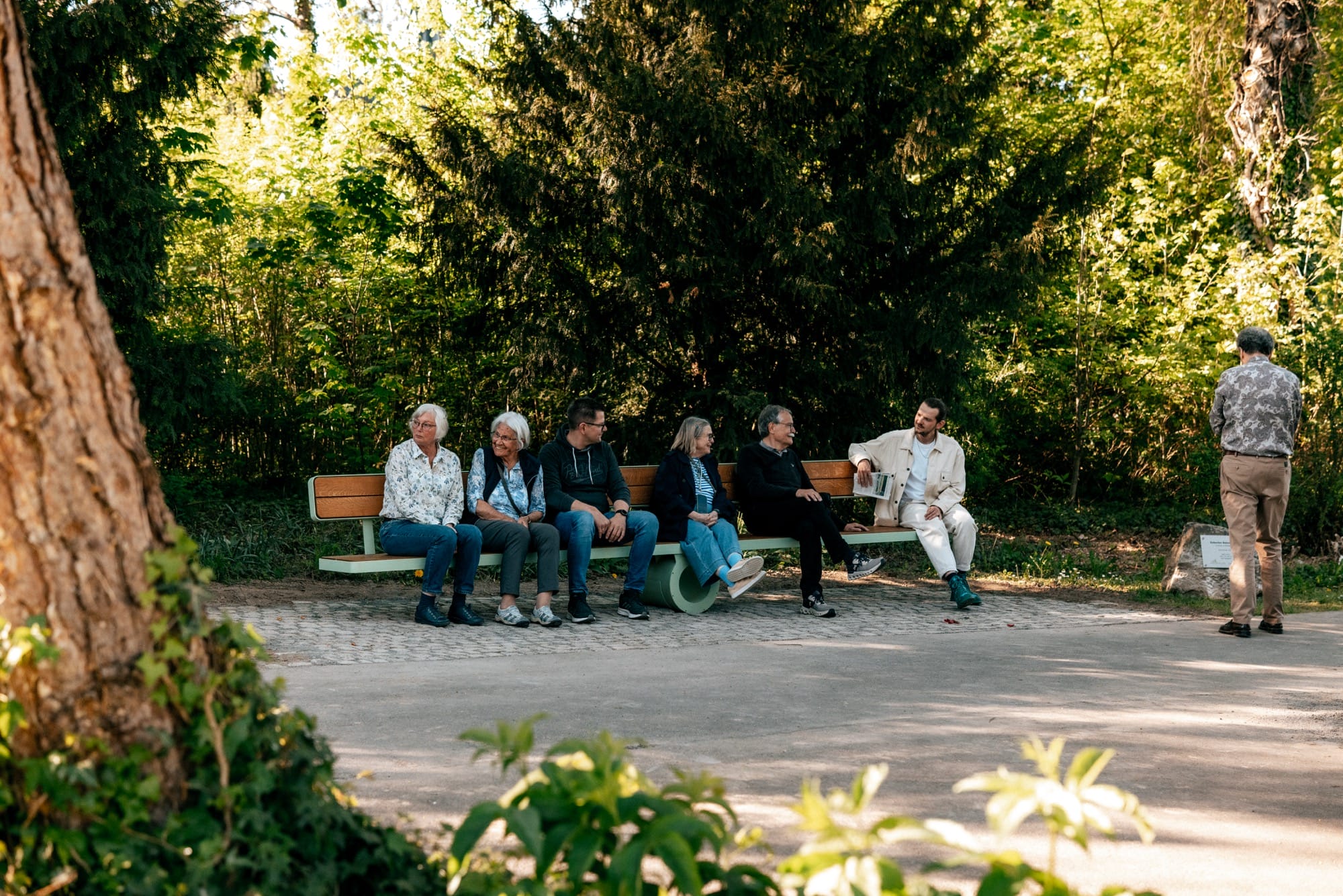 a bench sits perfectly flat as people balance on either side